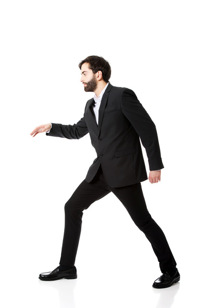 Businessman walking carefully. - Фото, изображение