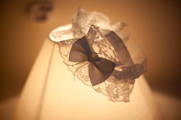 Wedding garter lace on lamp - Photo, Image