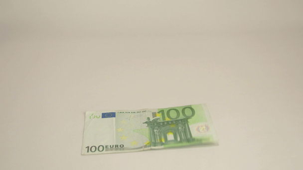 100 Euro bill drops off the table - Кадри, відео