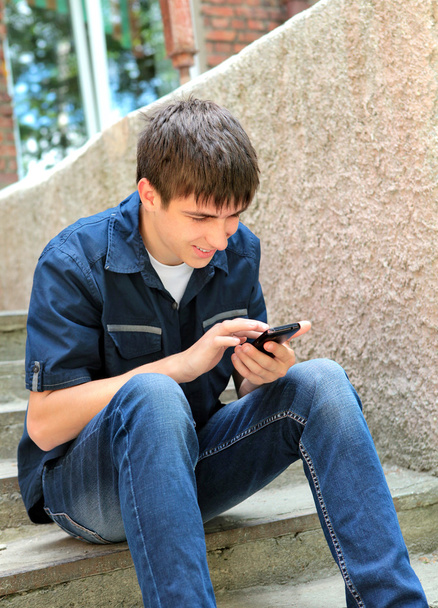 Teenager with Cellphone - Valokuva, kuva