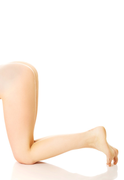 Nude woman's legs and buttocks - Foto, Bild