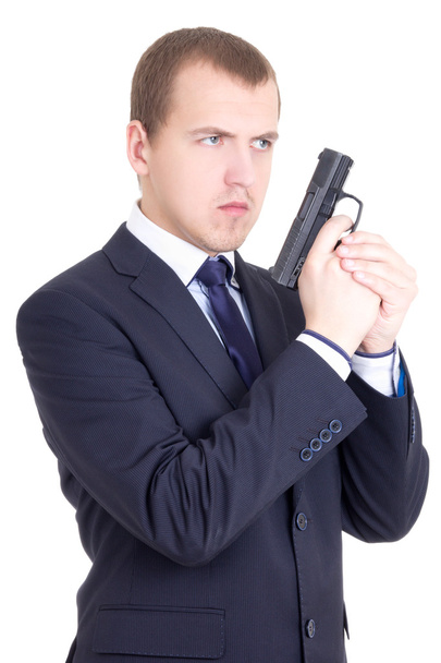 young serious man in business suit with gun isolated on white - Photo, Image