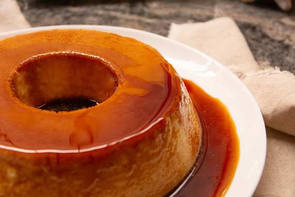 Creme Caramel Condensed Milk Pudim with melting caramel topping in front view - Photo, Image