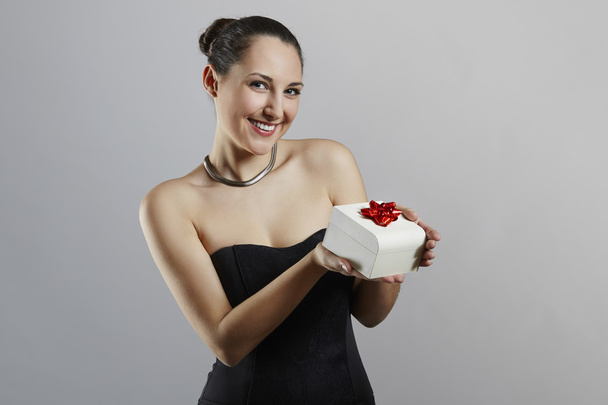 Attractive woman with gift box - Fotó, kép