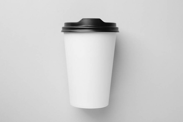 One paper cup on light grey background, top view. Coffee to go - Fotó, kép