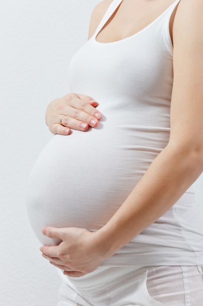 Pregnant woman touching here belly - Zdjęcie, obraz