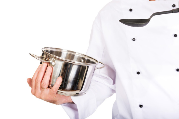 Chef's hand with stainless steel pot and spoon - Photo, image