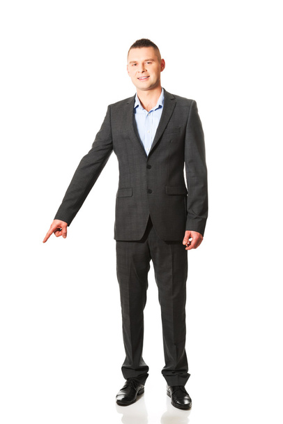 Businessman pointing down - Photo, Image
