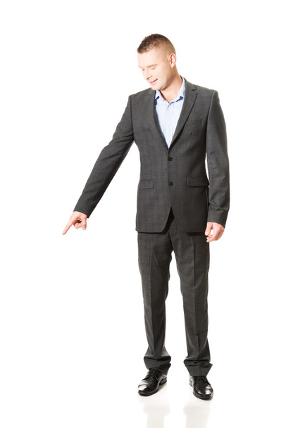 Businessman pointing down - Photo, image