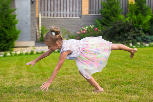 Adorable little girl happy outdoor at summer time - 写真・画像