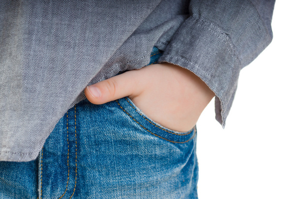 Children's hand in the pocket of jeans. Close-up. Background. - Fotó, kép