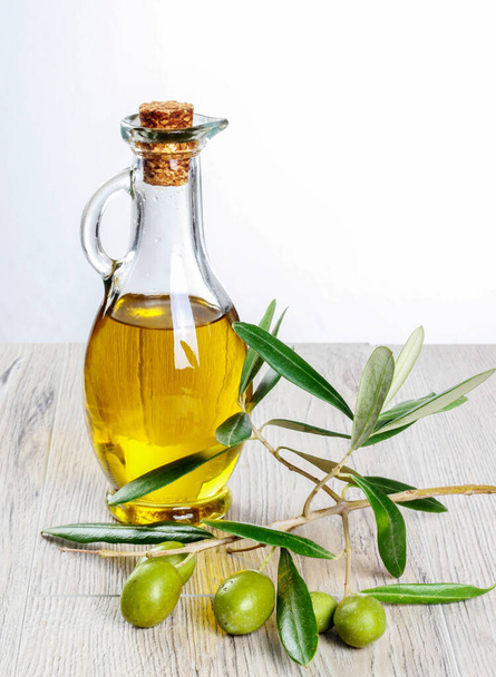 Green fresh olive and olive oil isolated. - Photo, Image
