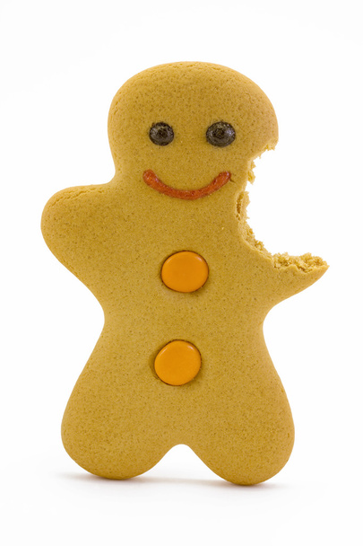 Gingerbread man with bite missing over white. - Photo, Image