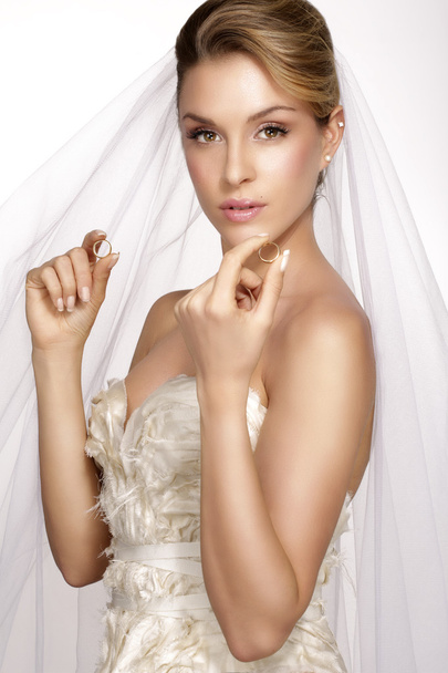 portrait of  young woman in wedding dress posing with white brid - Zdjęcie, obraz