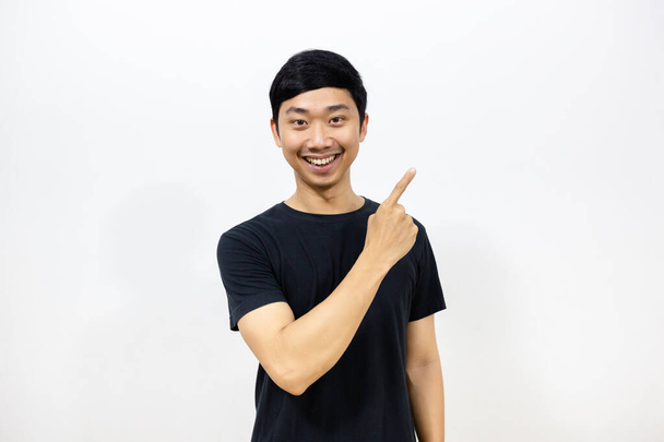 Handsome asian man smile show point finger isolated - Photo, Image