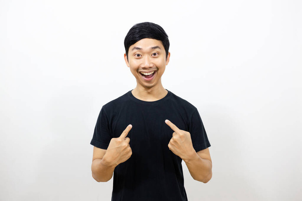 Positive asian man black shirt smile and gesture point finger at himself isolated - Photo, Image