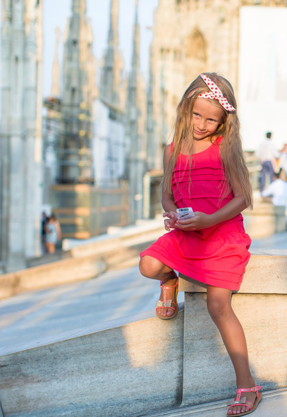 Adorable little girl on the rooftop of Duomo, Milan, Italy - Photo, Image