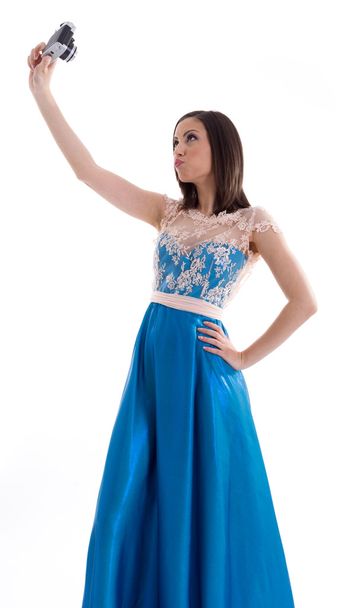 Beautiful woman in a blue dress shooting - Fotó, kép