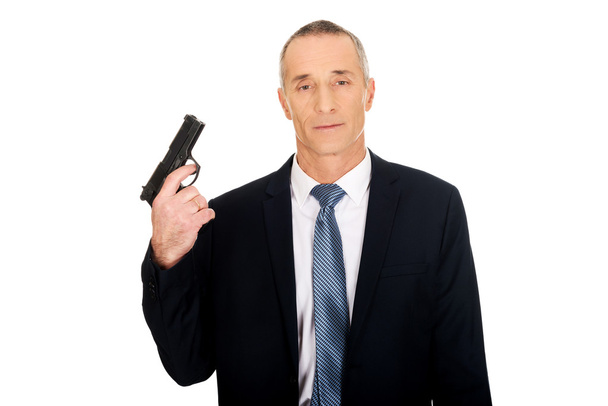 Portrait of serious mafia agent with handgun - Foto, Imagem