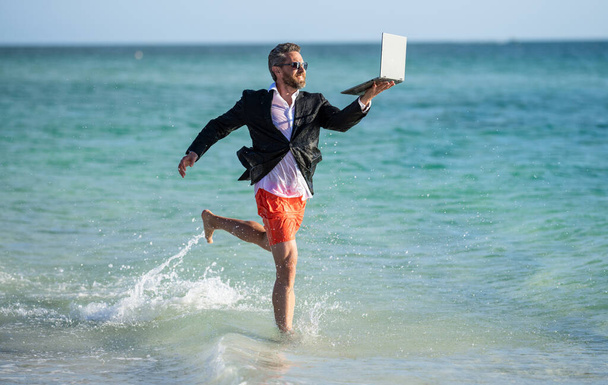 business success. Beach productivity for the director businessman. Businessman director running at the beach. director is very ambitious and carefree businessman. summer inspiration for business man. - Fotó, kép