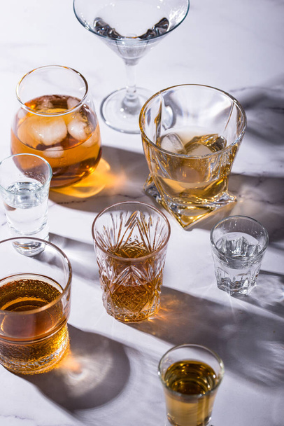 Assortment of strong alcohol drinks. Cognac, scotch, whiskey, tequila, vodka - Fotoğraf, Görsel