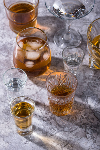 Assortment of strong alcohol drinks. Cognac, scotch, whiskey, tequila, vodka - Foto, imagen