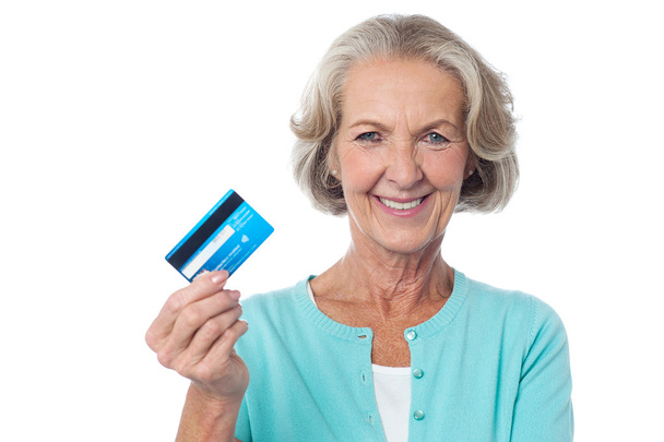 Woman showing her debit card - Photo, image