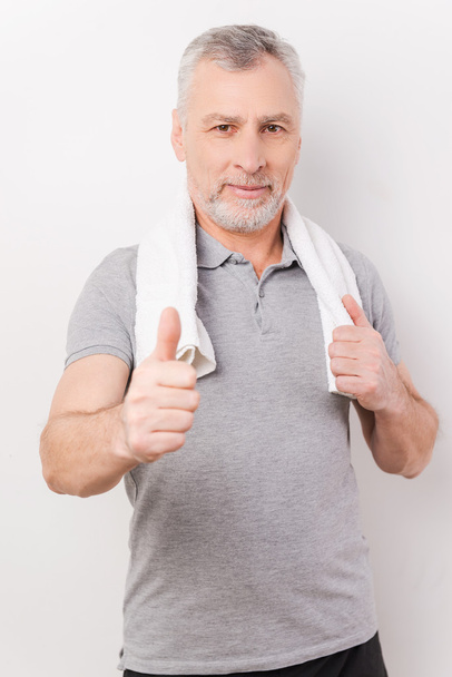 Grey hair senior man showing thumb up - Foto, Imagen