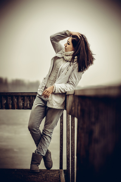 Pretty young girl outdoor on the old bridge - Foto, Bild