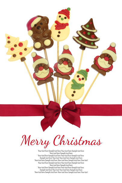 Festive Christmas chocolate confectionery on a stick isolated on white - Photo, Image
