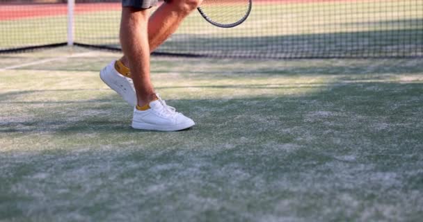 Man legs in sports sneakers on tennis court. Choice of sports shoes for sports - Filmmaterial, Video