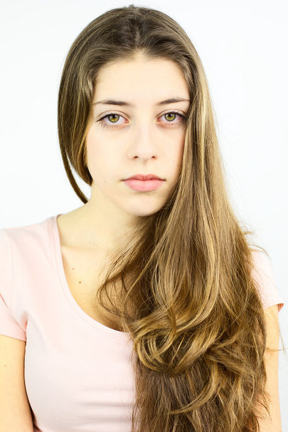 Female teenager with blonde hair looking camera - Fotó, kép