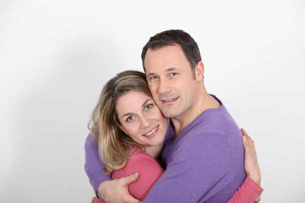 Portrait of in loved couple standing on white background - Photo, Image