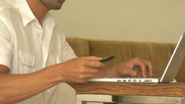 Man using a laptop - Felvétel, videó