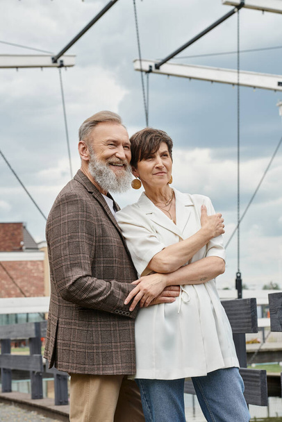 seniors and love, happy elderly couple hugging and standing together outdoors, bearded man, woman - Fotografie, Obrázek