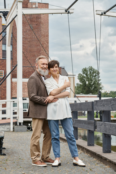 couple in love, happy elderly couple hugging, standing together outdoors, bearded man, woman, date - Photo, Image