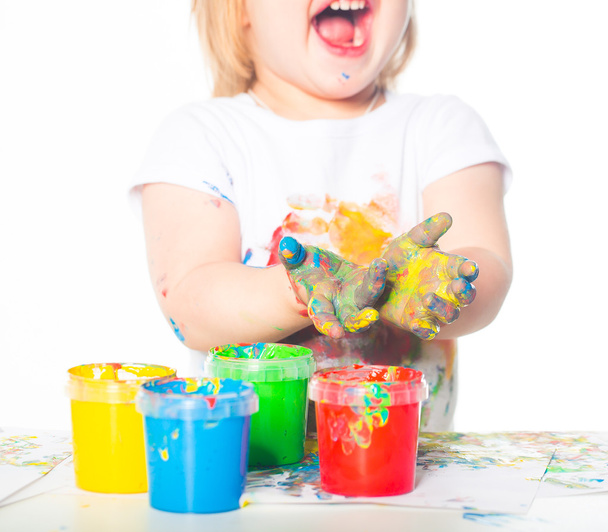 Little girl playing with finger paints - Photo, Image