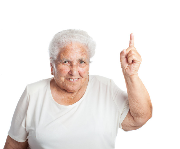 Old woman pointing up with finger - Foto, Imagen