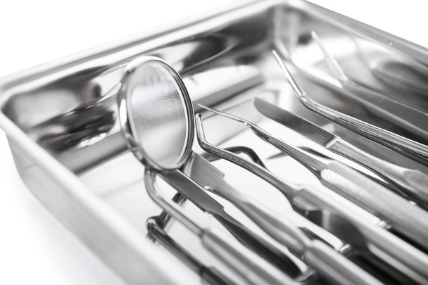 Set dentist tools on tray close up - Foto, immagini