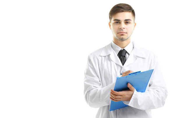 Male Doctor holding clipboard isolated on white - 写真・画像