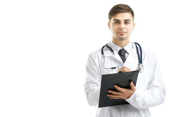 Male Doctor holding clipboard isolated on white - Fotó, kép