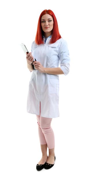 Young beautiful doctor with clipboard isolated on white - Фото, зображення
