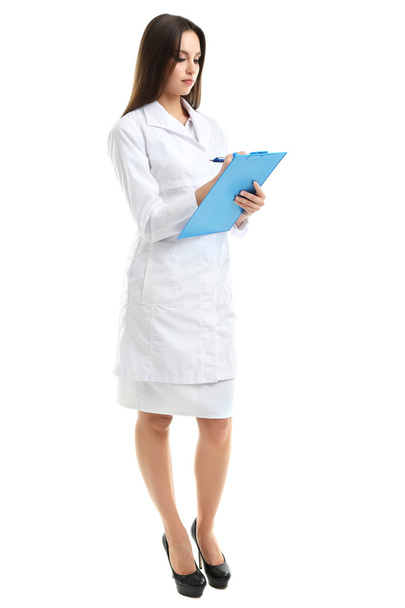 Young beautiful doctor with clipboard isolated on white - Foto, Bild