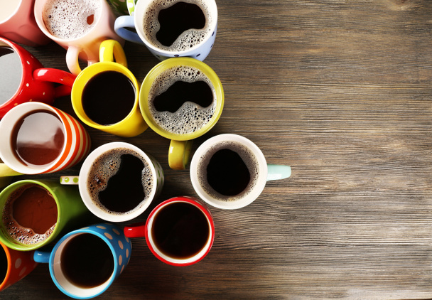Many cups of coffee on wooden background - Photo, Image