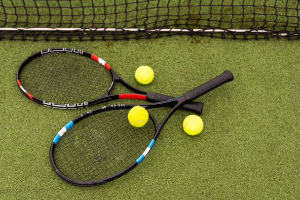 Tennis racket and tennis ball on court - Photo, Image