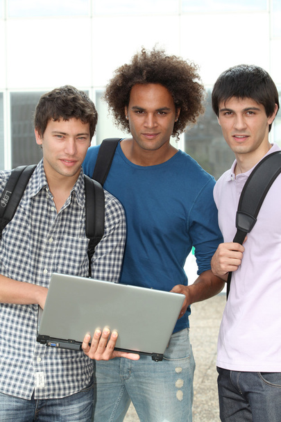 Group of students with laptop computer - Фото, изображение