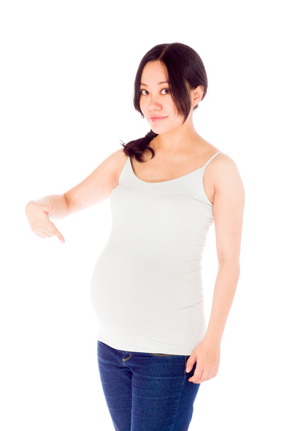 Έγκυος γυναίκα που δείχνουν προς τον εαυτό της - Φωτογραφία, εικόνα