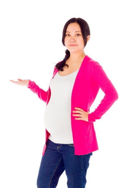 Pregnant woman presenting showcasing - Photo, Image