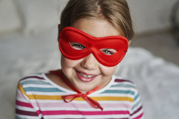 Portrait of caucasian girl wearing superhero costume  - Photo, Image