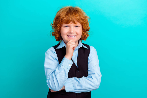 Photo of intelligent minded positive kid hand touch chin toothy smile contemplate isolated on teal color background. - Φωτογραφία, εικόνα